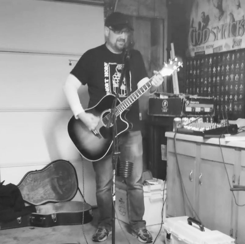 Bill Stage playing acoustic guitar by ear in his home studio