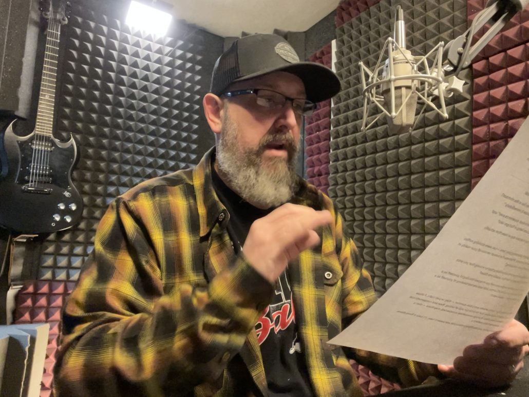 Bill Stage reading script in whisper room home voice over recording booth