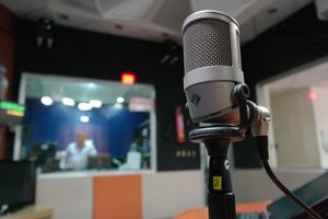 Studio microphone in a broadcast booth representing the radio to voice over transition for working voice over artists