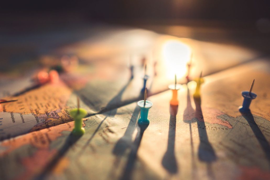 Push pins on a world map, the reach behind voice over for international ad campaigns